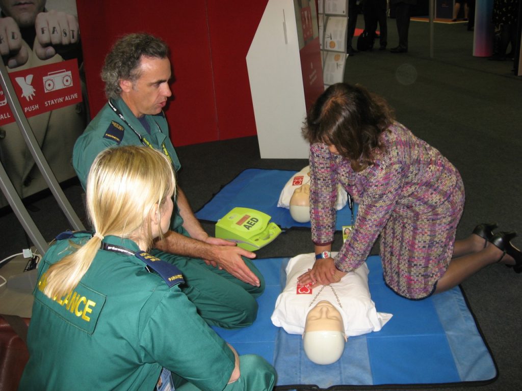Valerie practicing Hands-only CPR